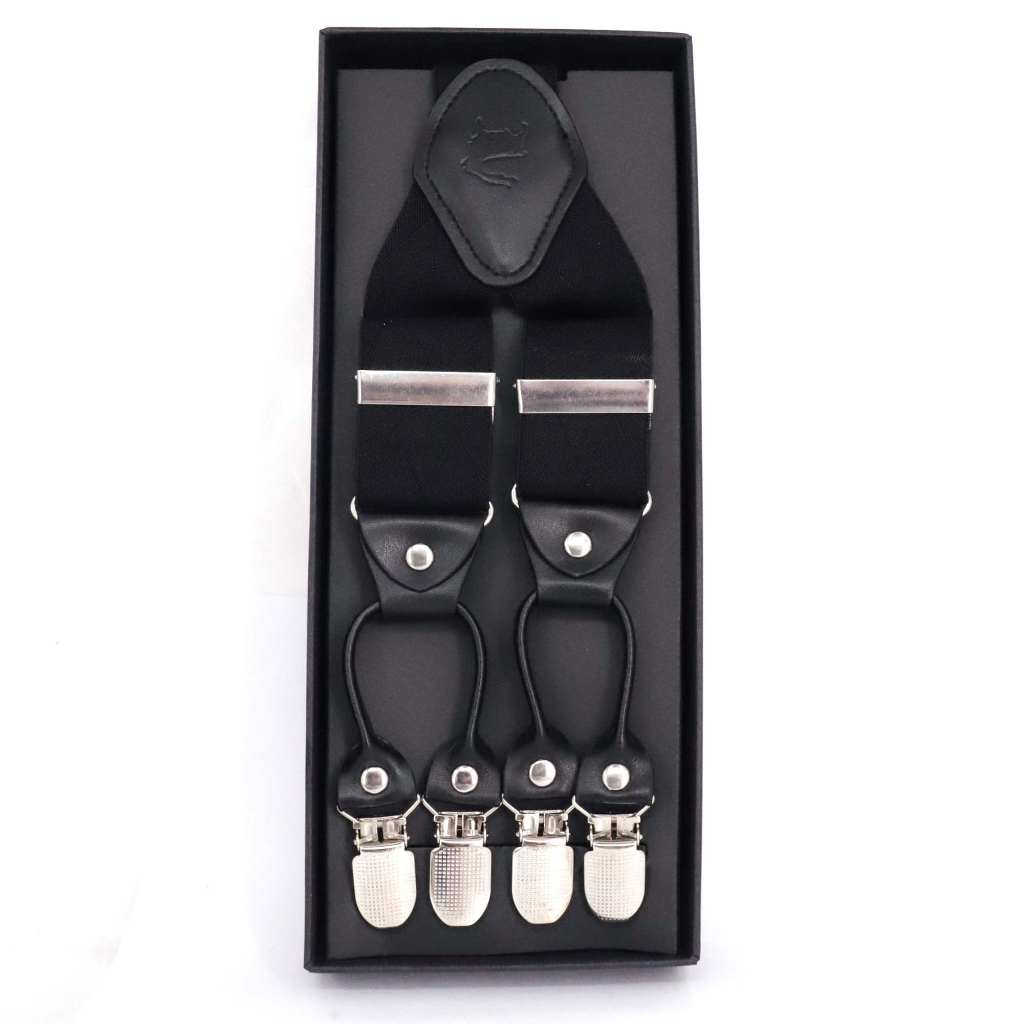A pair of black Orobianco L'unique suspenders with gray detailing, presented in a black box with the brand's logo on the top.