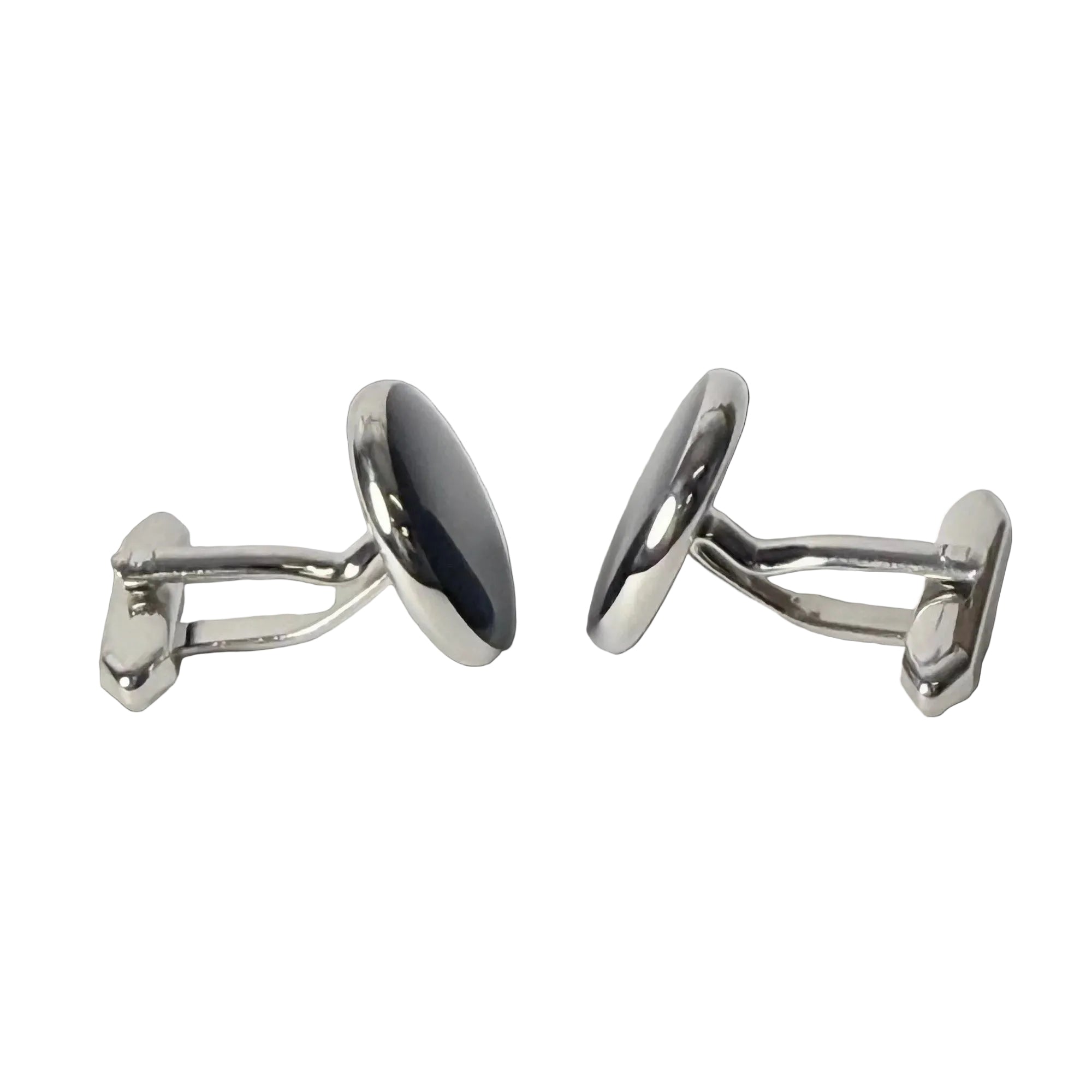 Pair of silver oval cufflinks on a light gray background