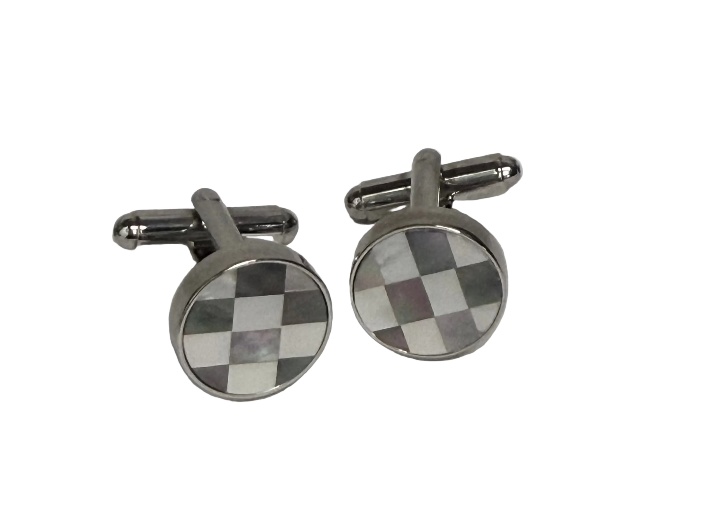 A pair of round silver-toned cufflinks with a checkered pattern in brown, white, and gray mother-of-pearl inlay, displayed on a light gray background.