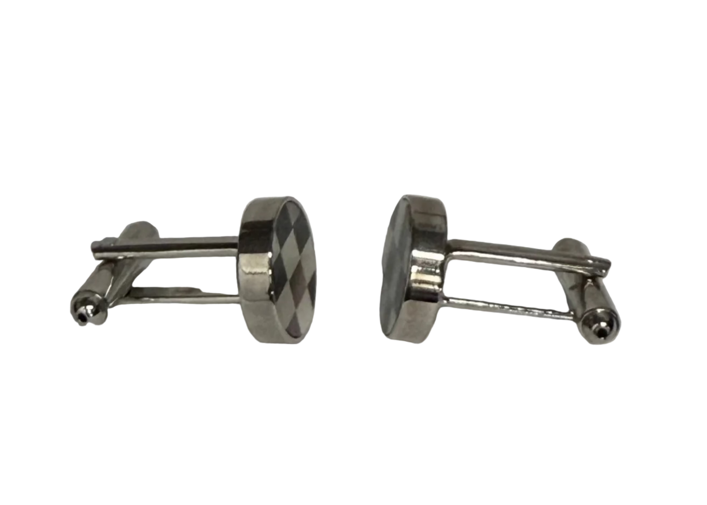 A pair of silver-toned metal cufflinks with oval faces, one showing a dark and light checkered pattern and the other showing a smooth polished finish, set against a plain light gray background.