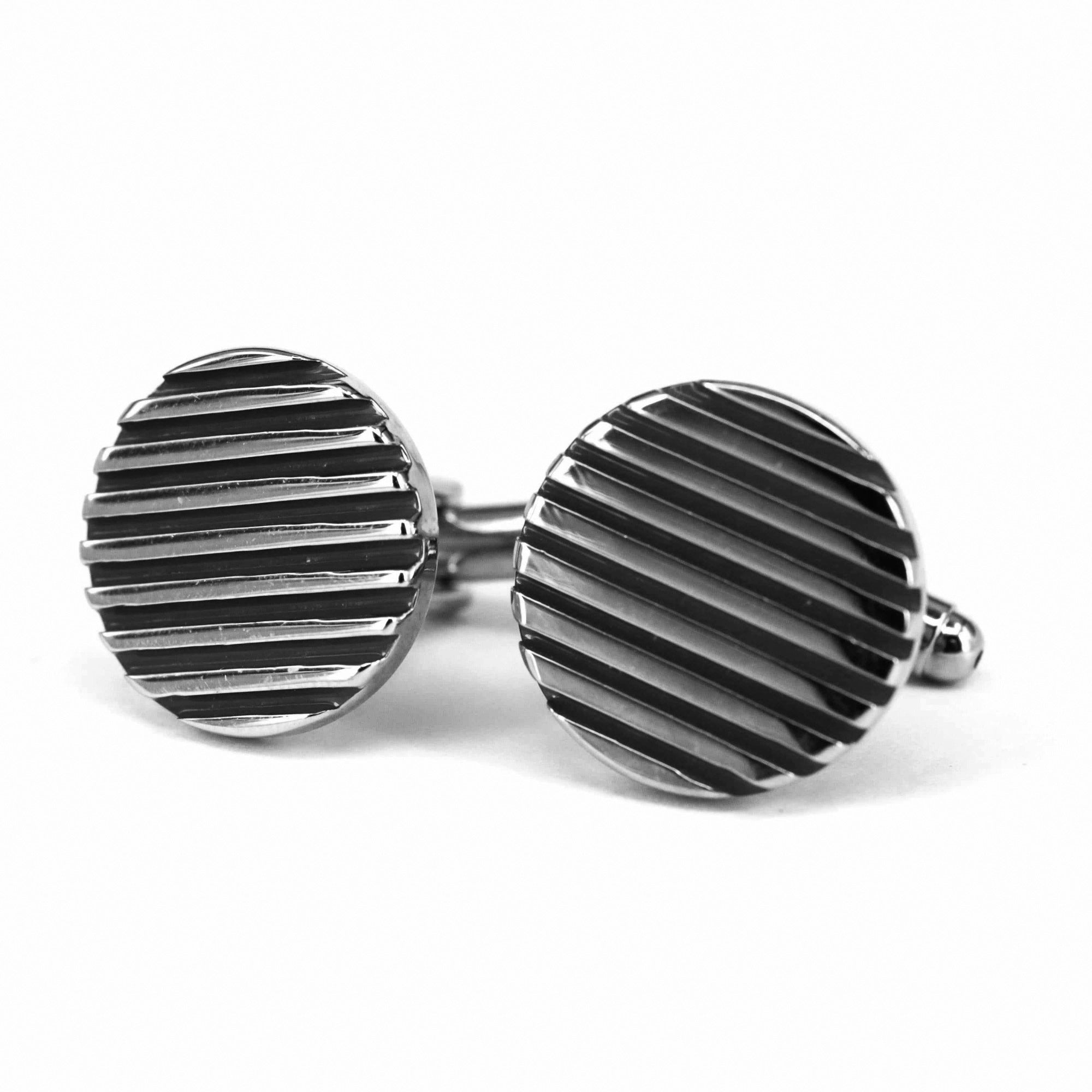 Round metallic cufflinks with striped design Black Enamel on a white background